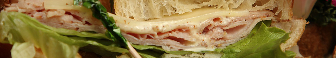 Eating Deli Sandwich at Just Sandwiches restaurant in Glen Ridge, NJ.